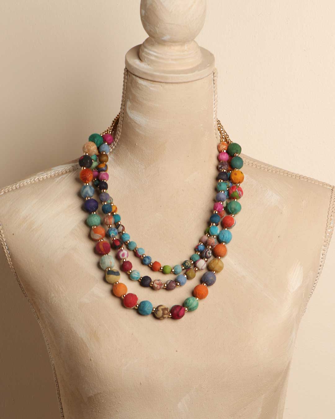 Handmade recycled fabric necklace with layered design