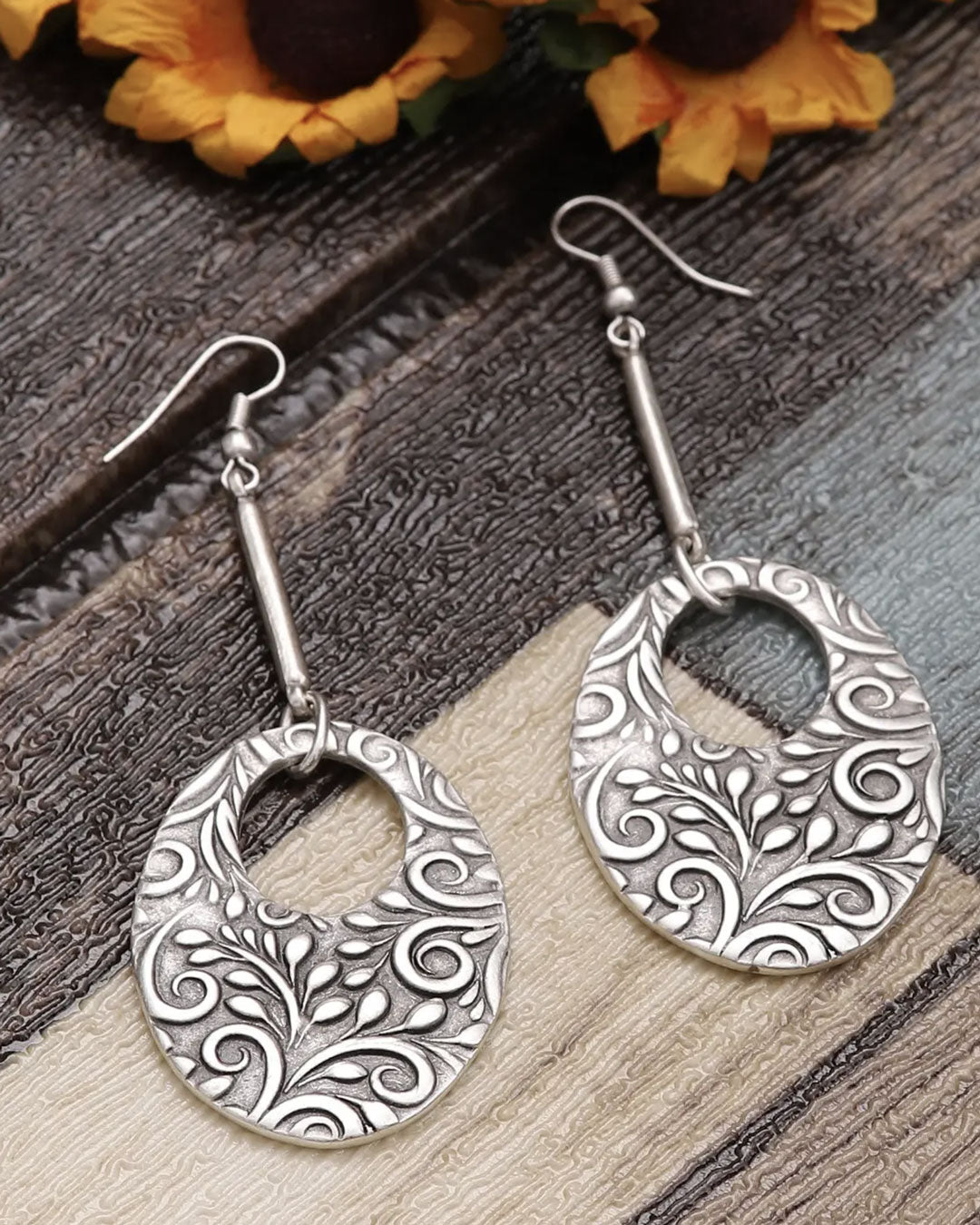 Long botanical engraved drop earrings