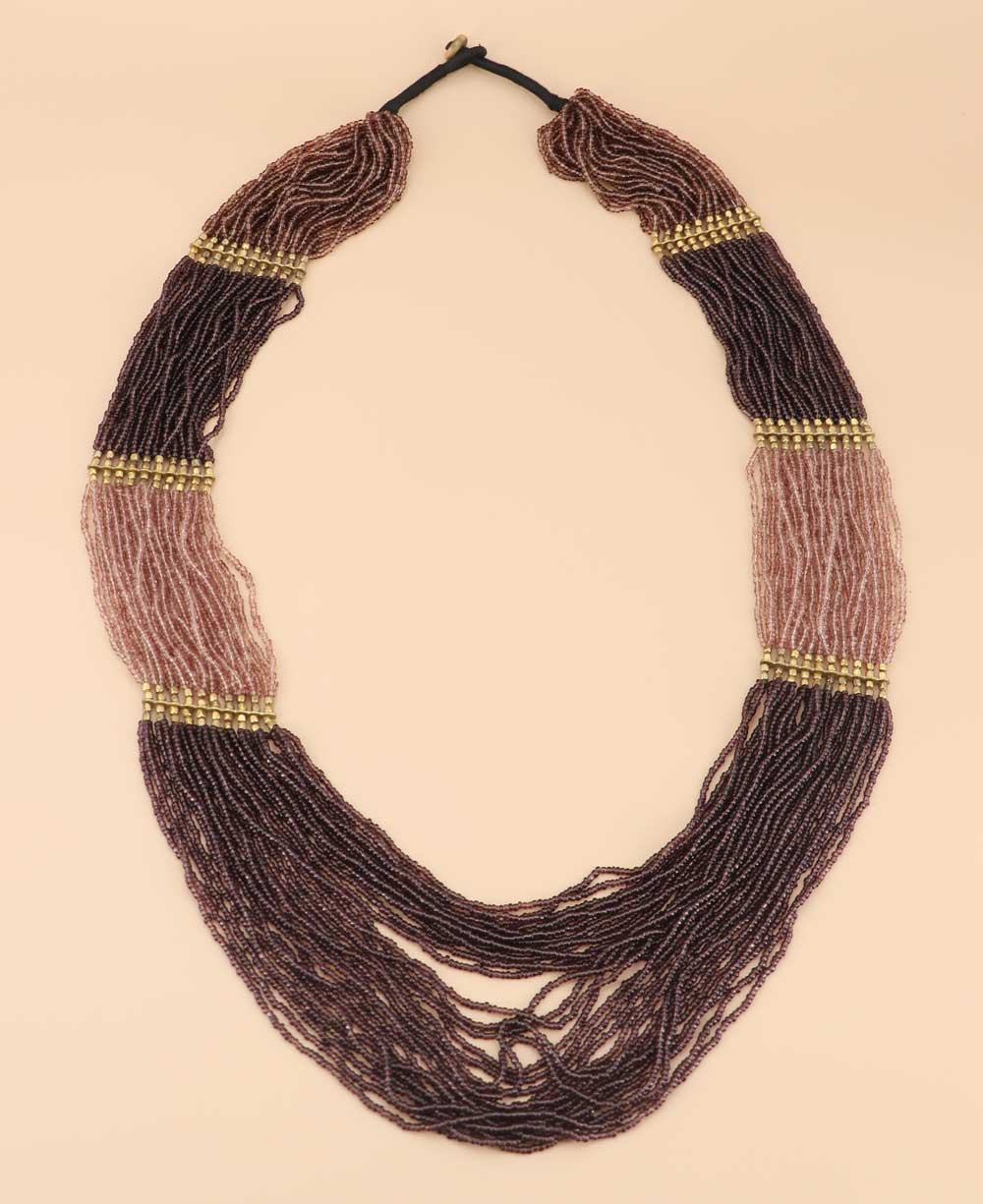 Wine red statement necklace with blush tones