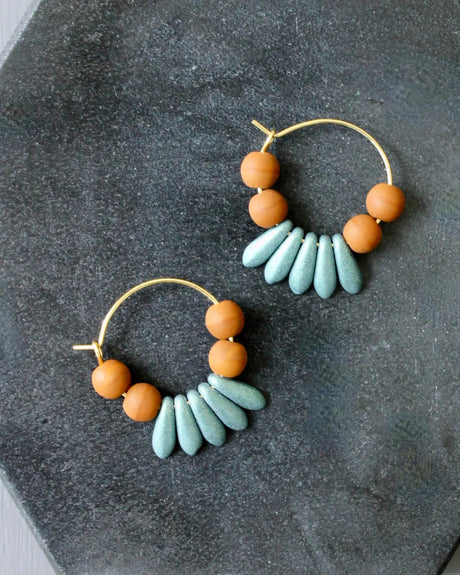 Hoop earrings with brown and blue glass beads