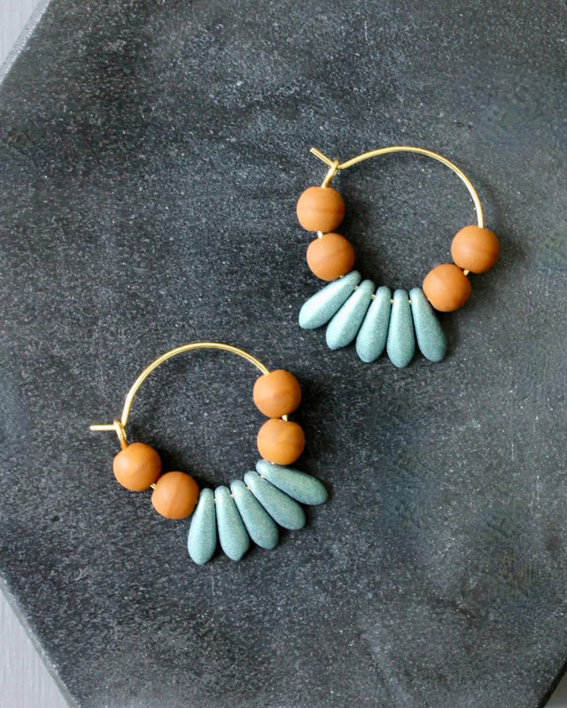 Hoop earrings with brown and blue glass beads