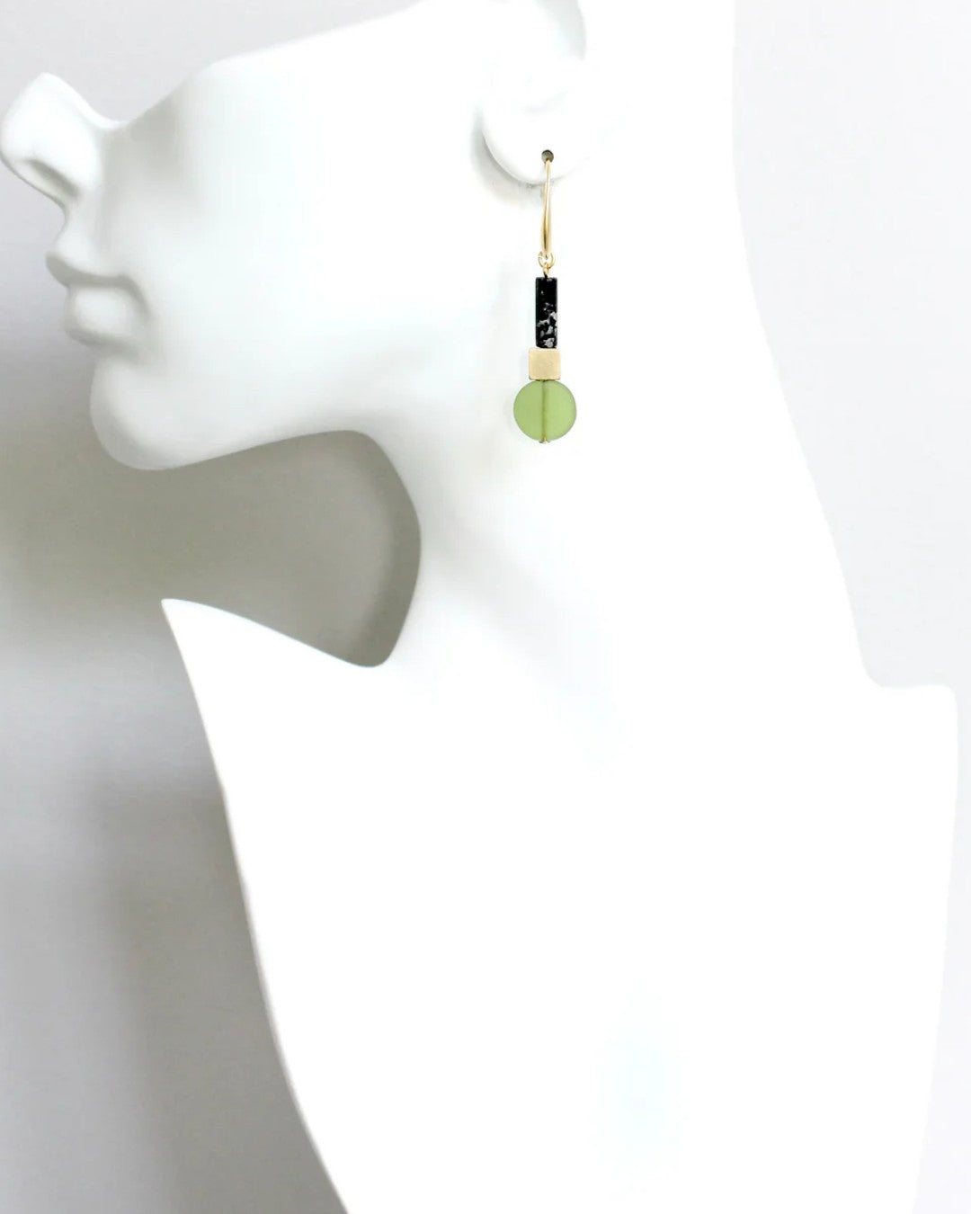 Modern artisan earrings with stacked shapes and textures