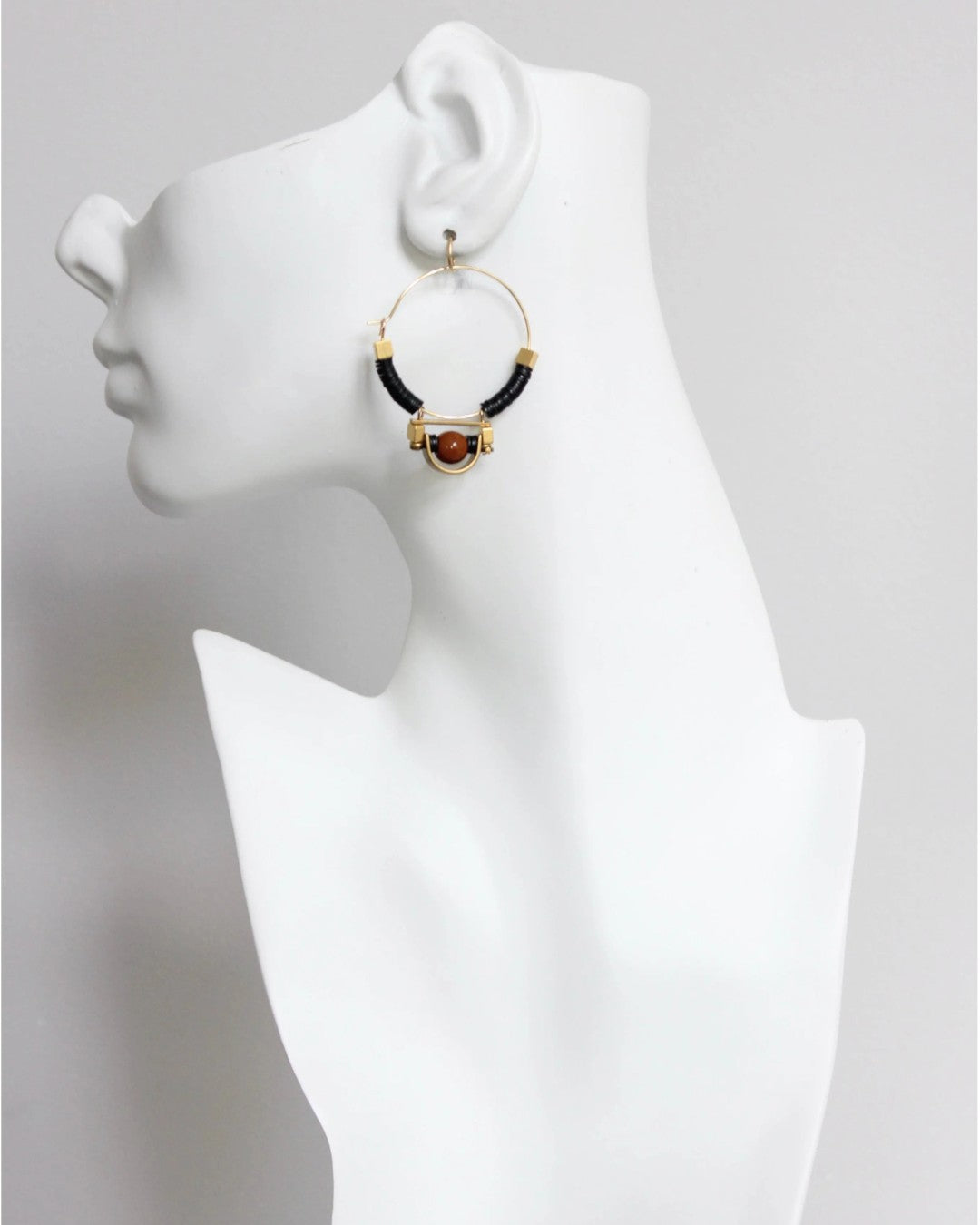 Handcrafted hoop earrings with vintage-style vulcanite discs