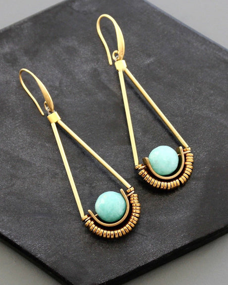 Long triangular gold earrings with mint green stones