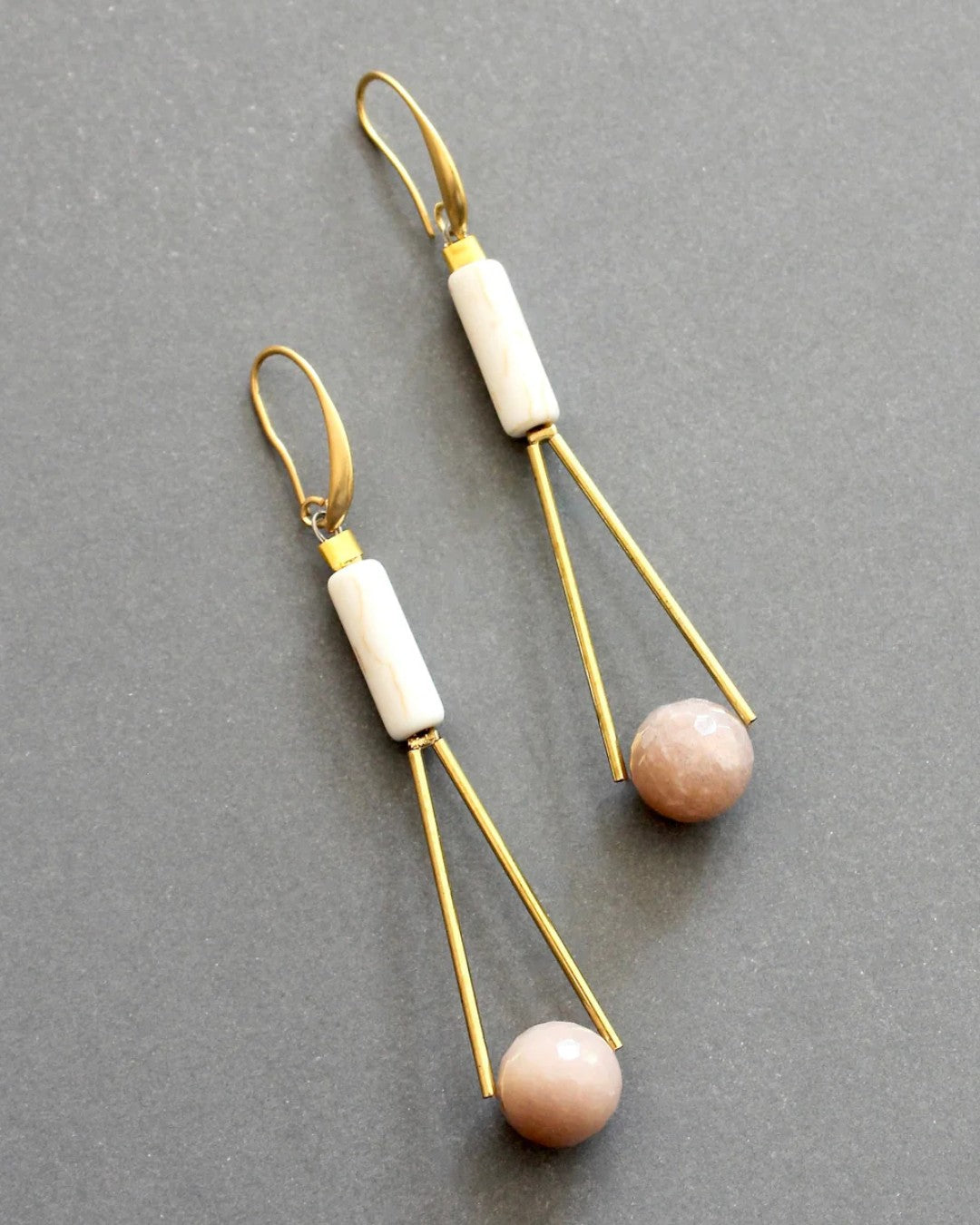 Long gold earrings with soft pink and cream natural stones