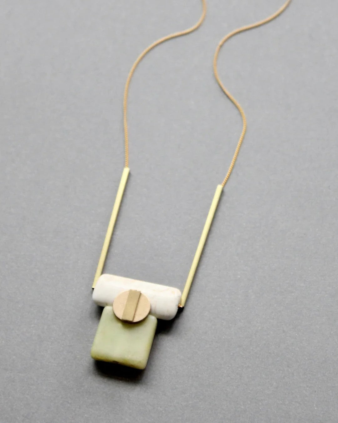 Square green serpentine and ivory magnesite pendant