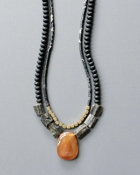 Double-strand necklace with orange agate pendant and black beads