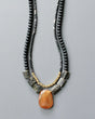 Double-strand necklace with orange agate pendant and black beads