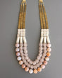 Triple strand fire agate necklace with magnesite and brass