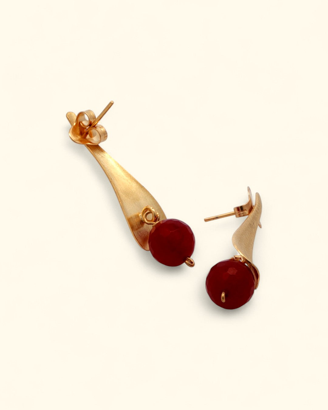 Red gemstone earrings with long gold drop