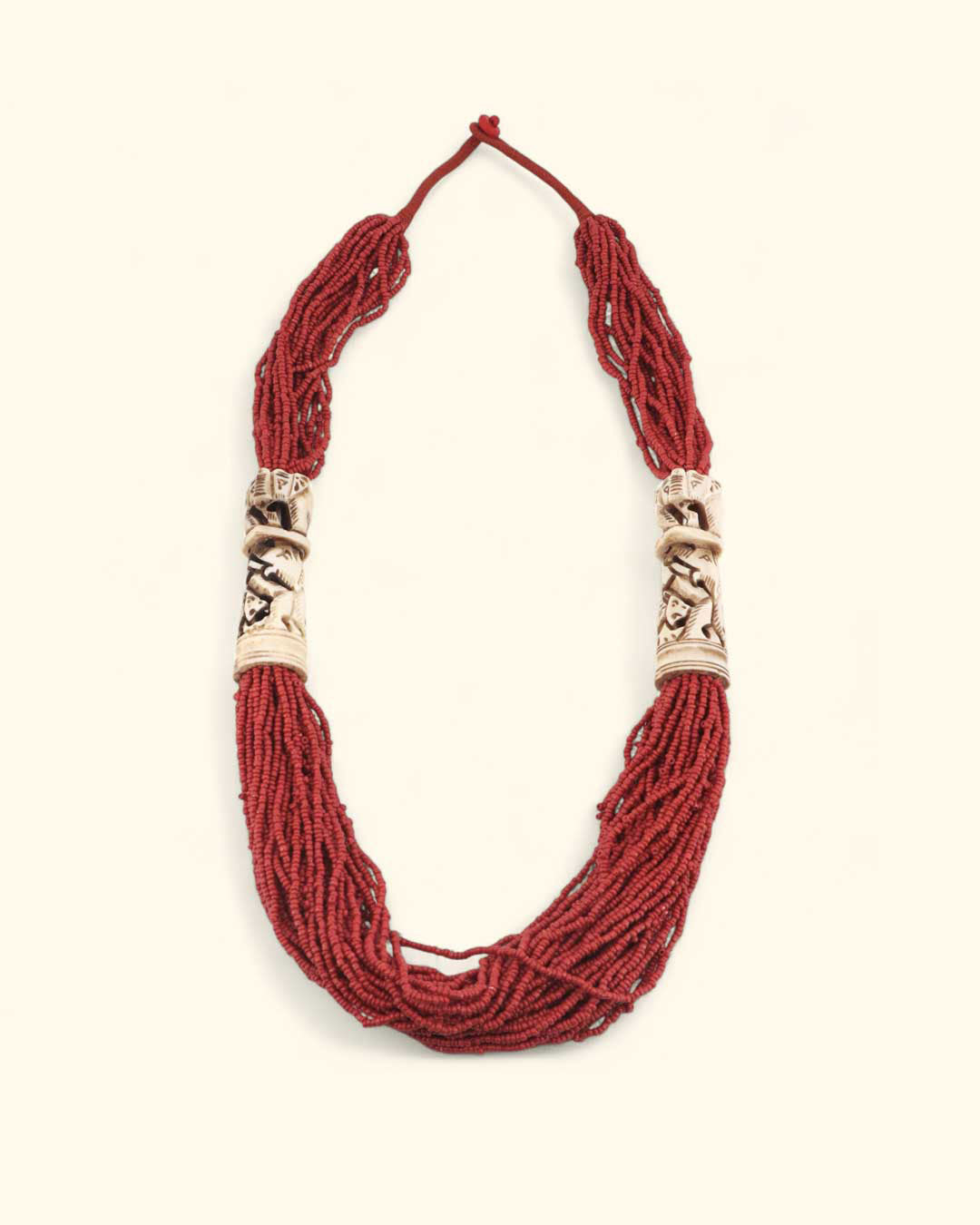 Red beaded necklace with carving