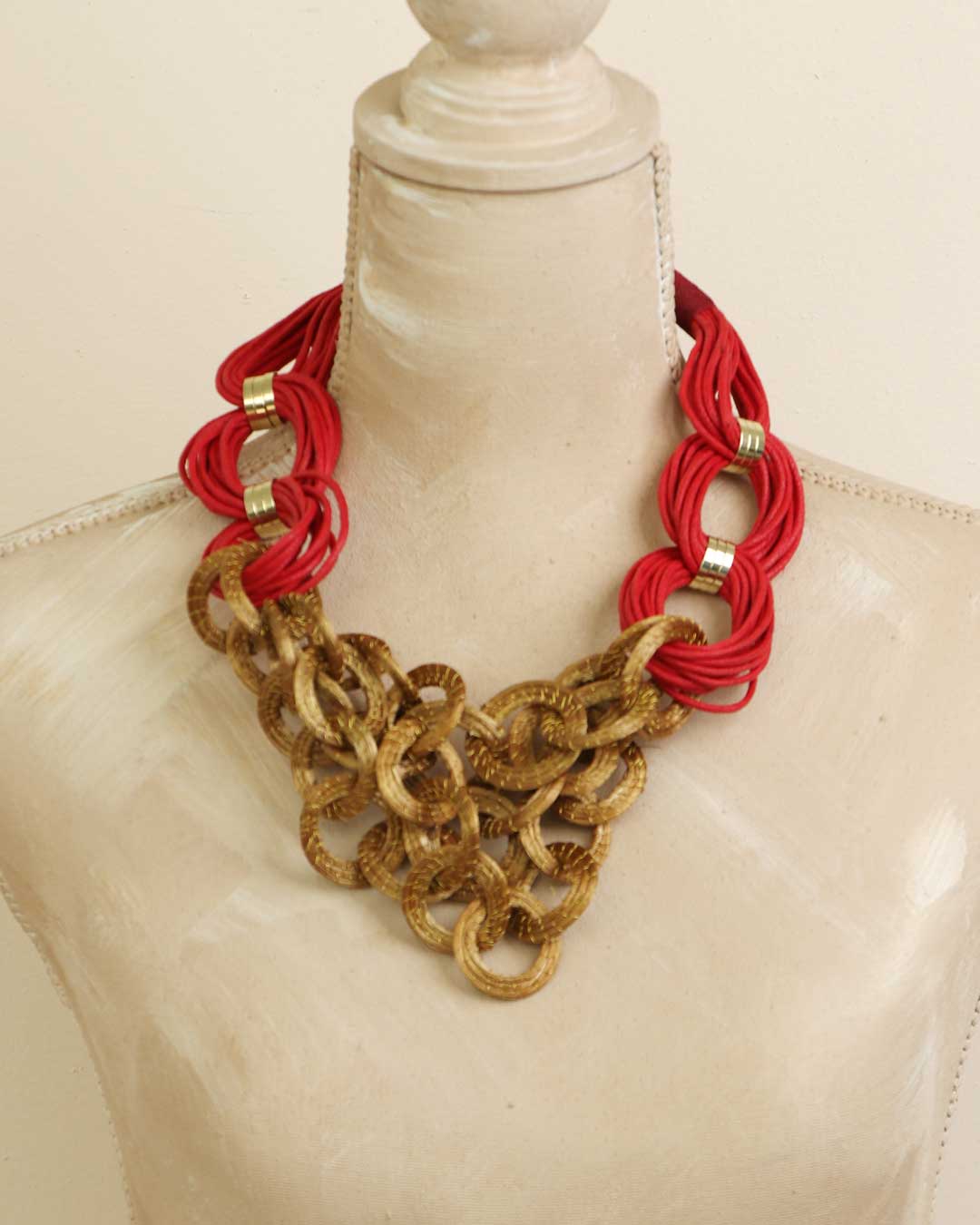 Statement necklace with woven grass rings and brass accents