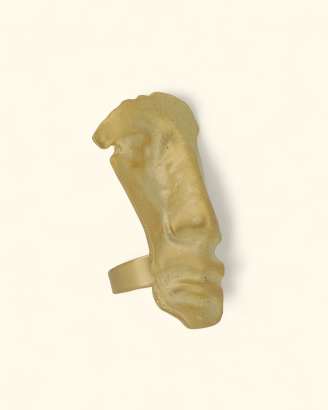 Modern statement ring with human face motif in gold finish