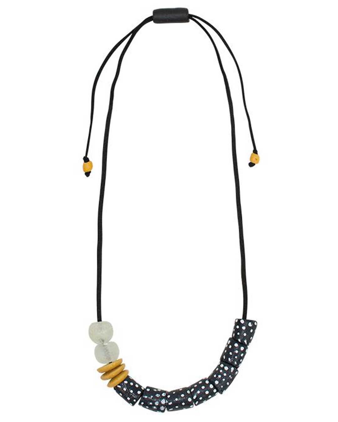 Black and white polka-dot artisan beads with amber accents