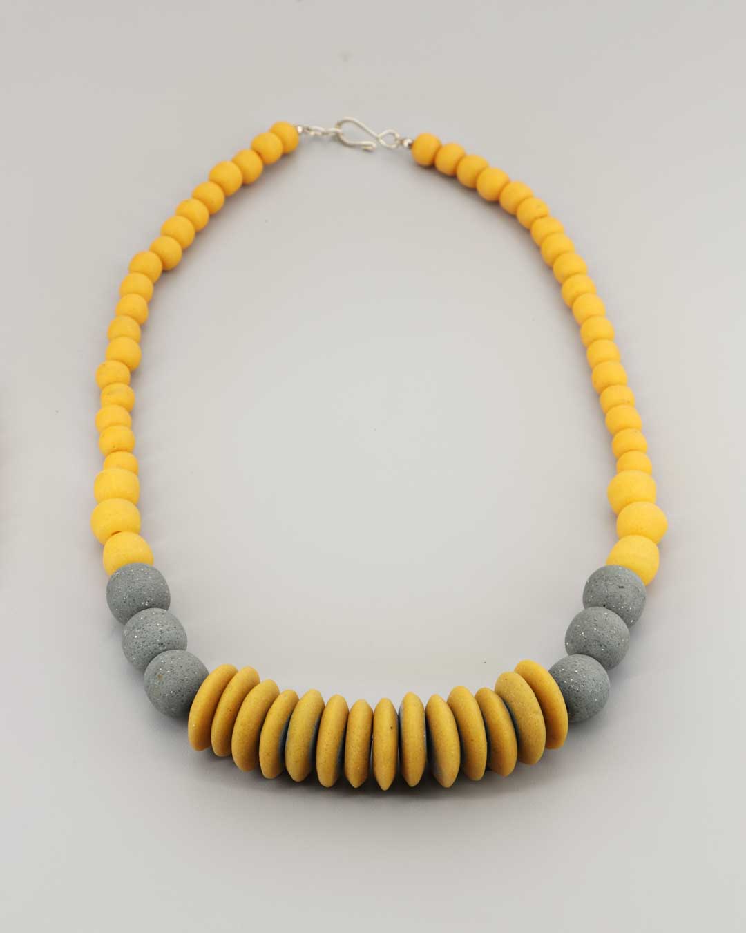 Artisan necklace with yellow ochre and slate grey beads