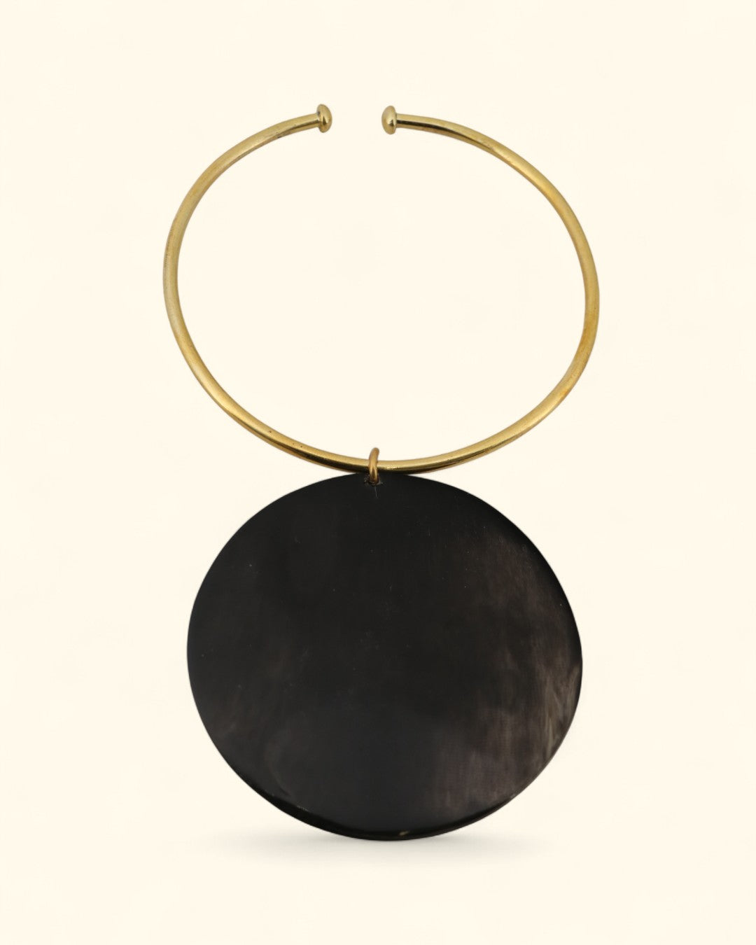 Brass collar necklace with large black horn pendant