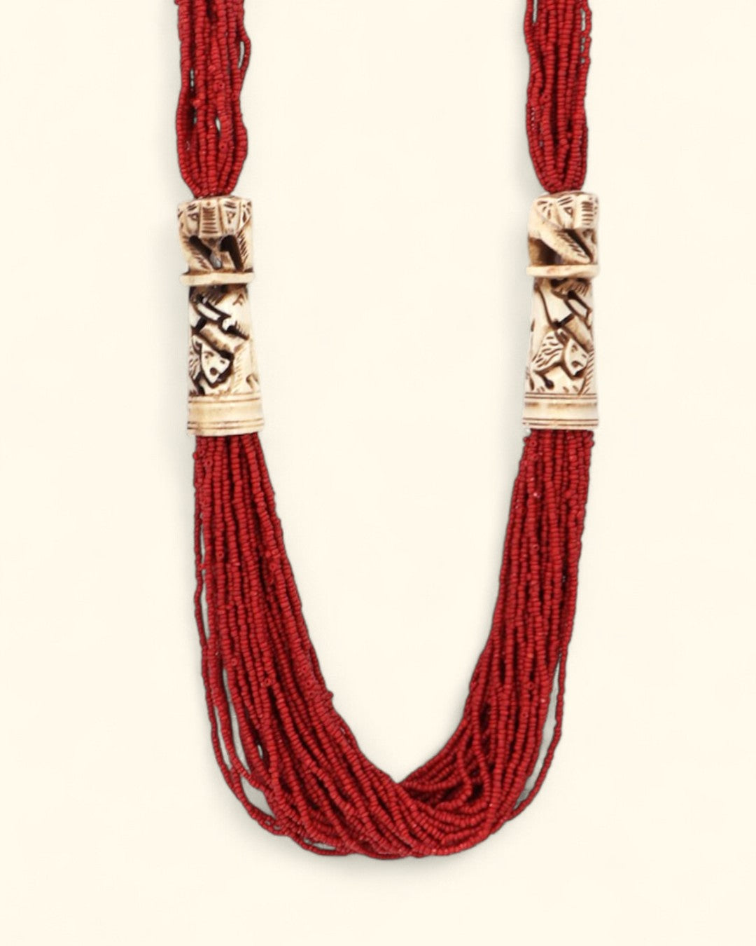 Red beaded necklace with elephant design carving