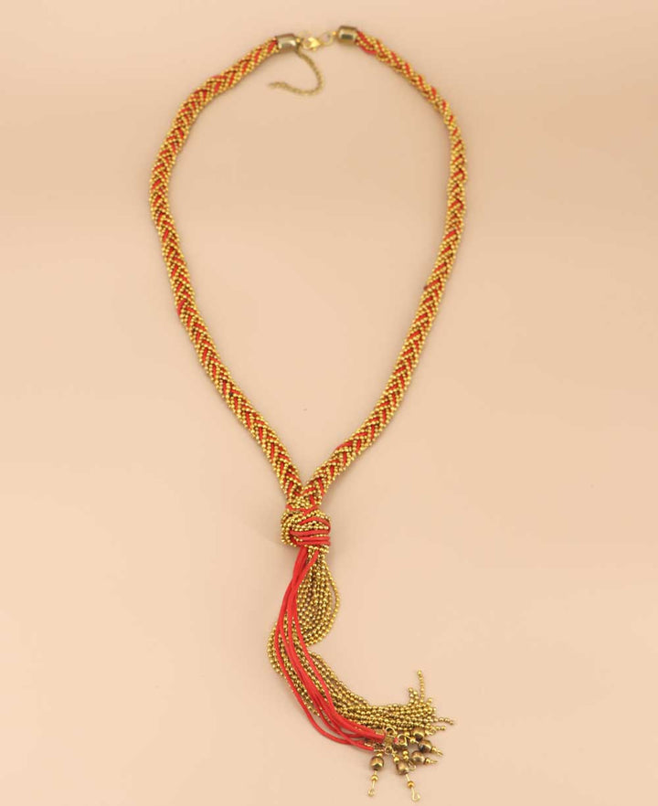 Artisanal red necklace with metal beads and threads
