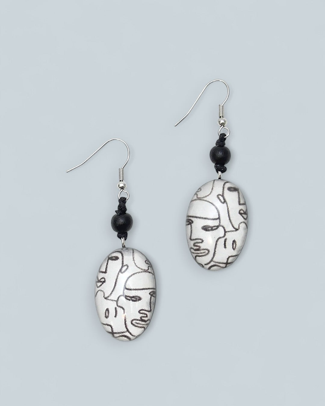 Black and white face line print dangle earrings