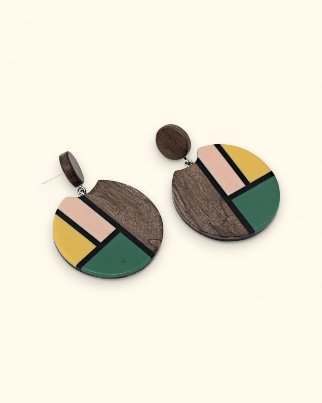 Handmade round wooden earrings with geometric painted design
