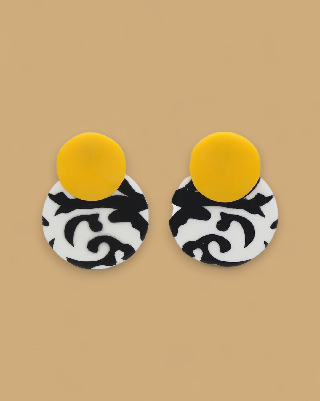 Black, white, and yellow double-disc resin earrings
