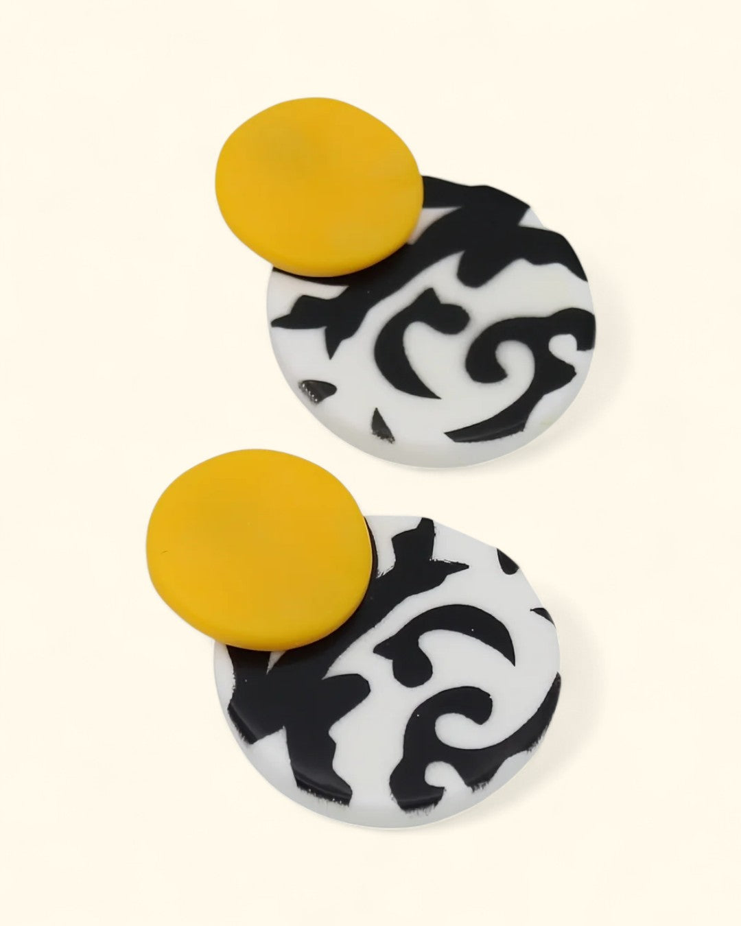 Hand-painted resin earrings with bold patterned design