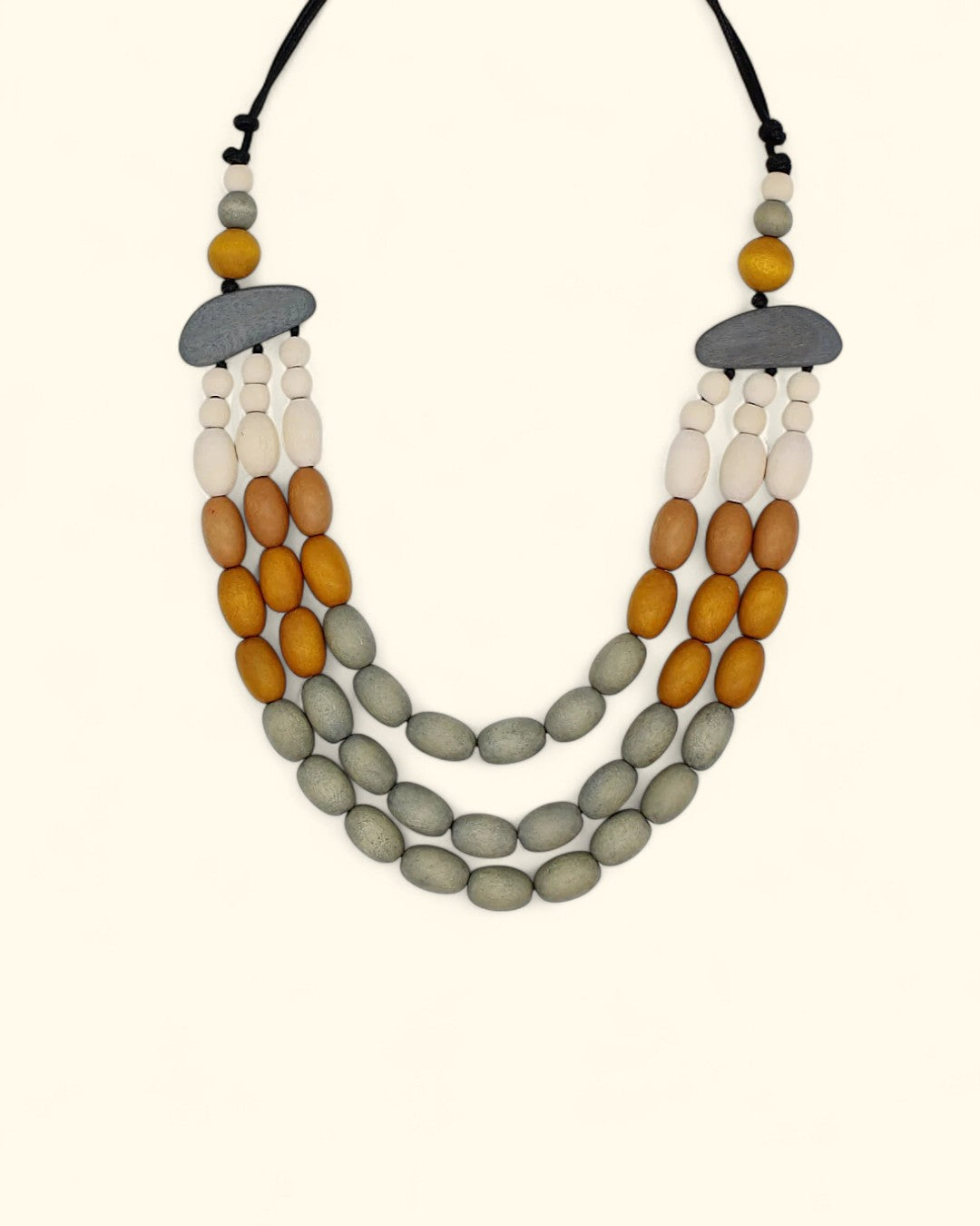 Triple-strand grey, mustard, and cream wood bead necklace