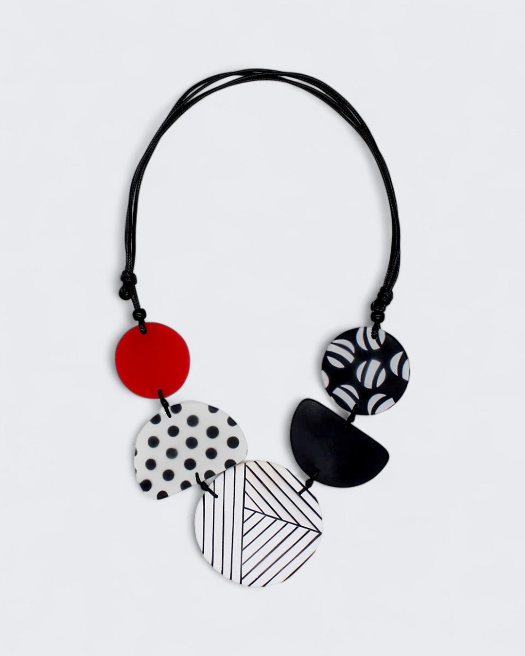 Statement necklace with polka dots, stripes, and geometric resin beads