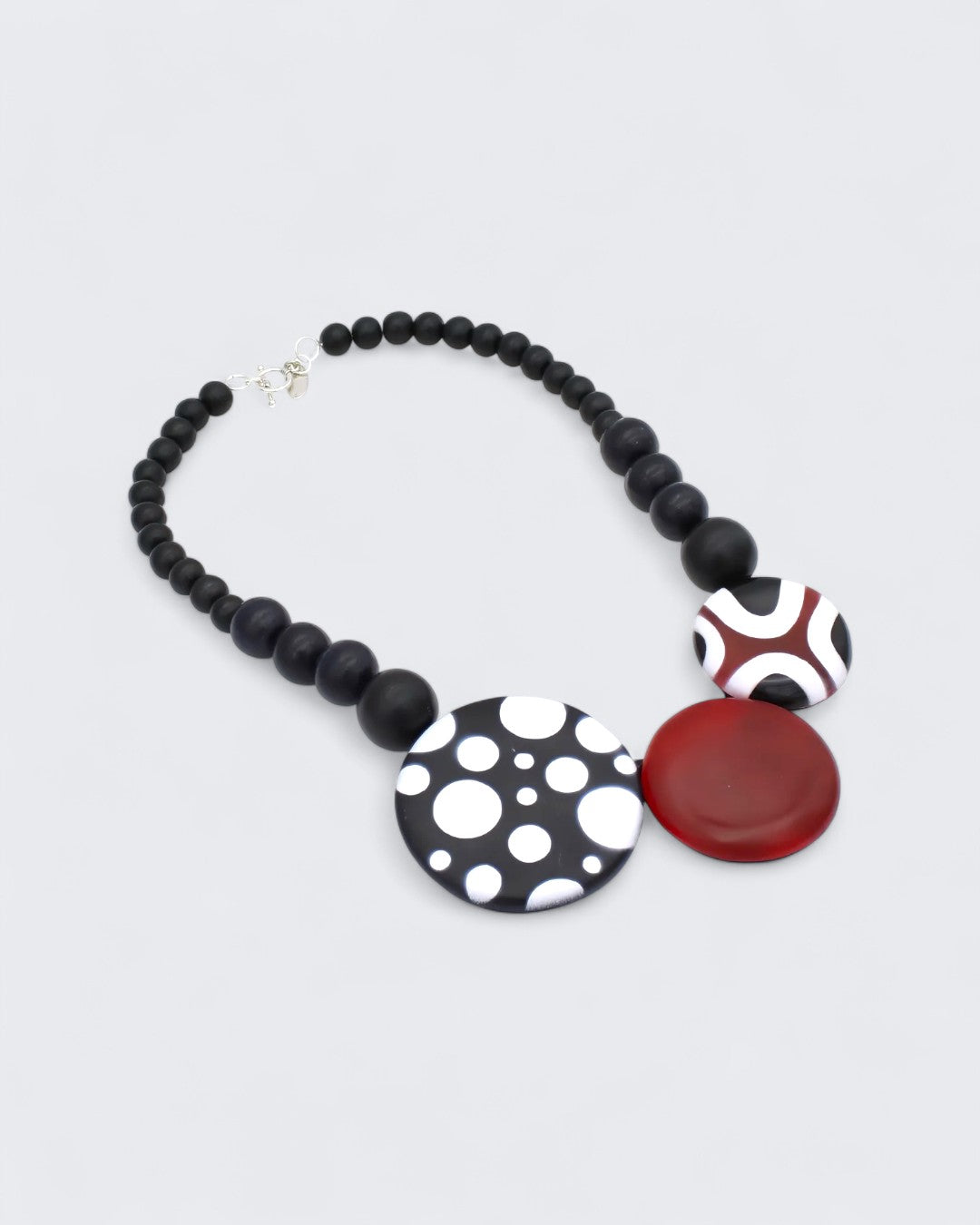 Artistic resin necklace with matte black wood bead strand