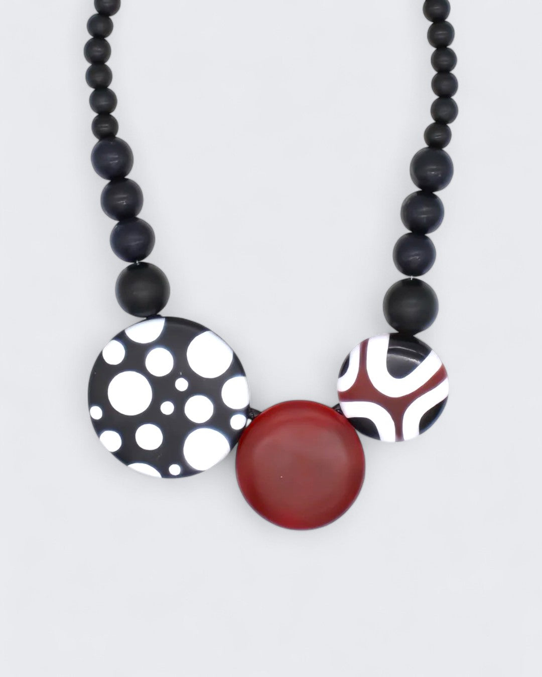 Black, white, and burgundy resin disc necklace with wooden beads