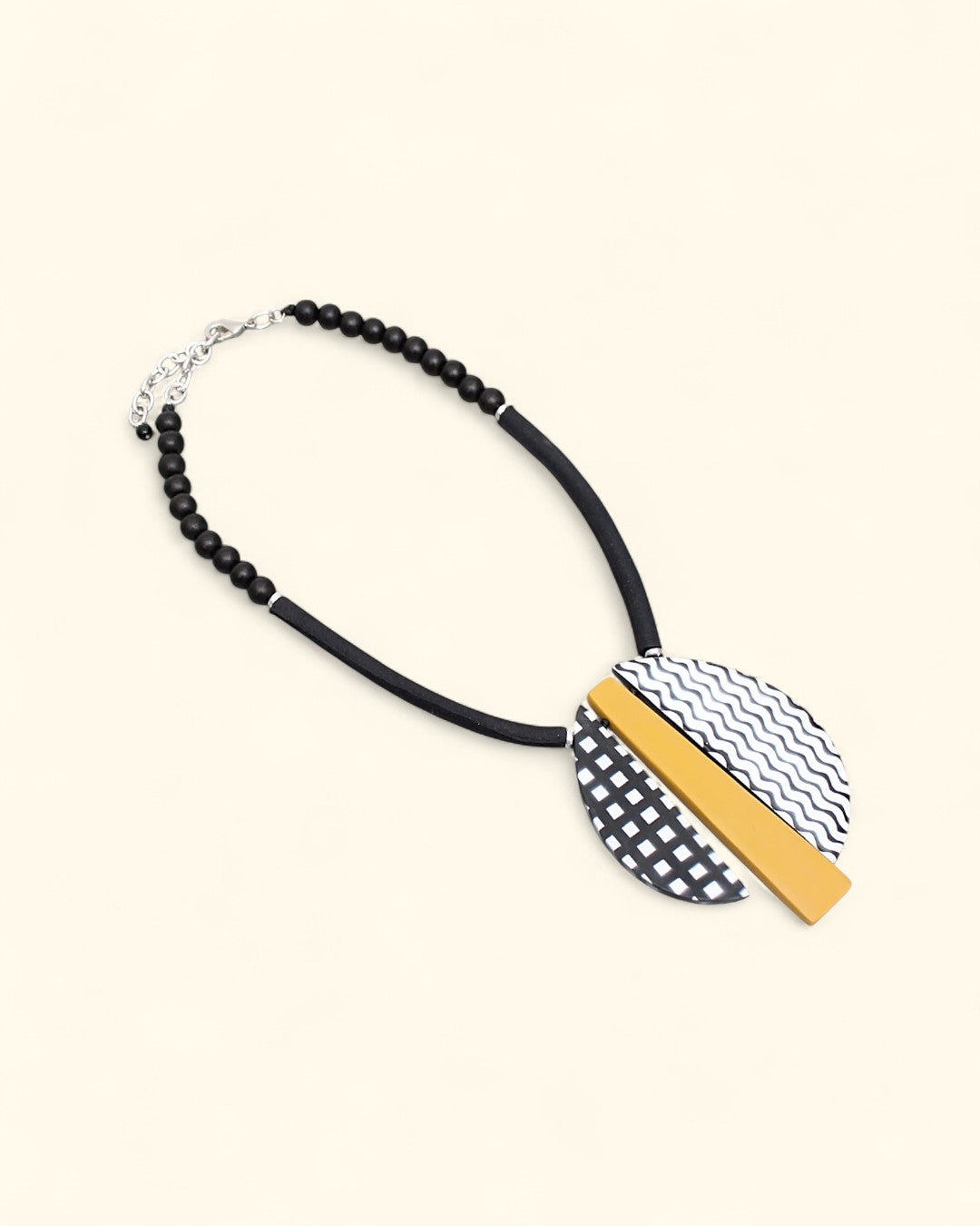 Statement necklace with black-and-white patterns and yellow accent