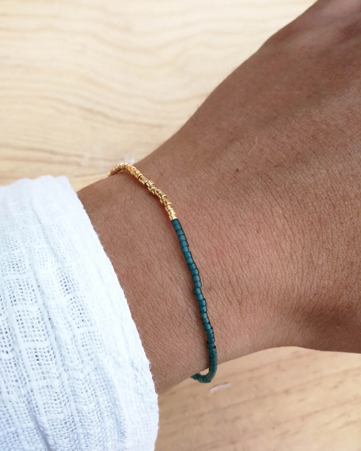 Stretchy primary color bead bracelets with gold highlights