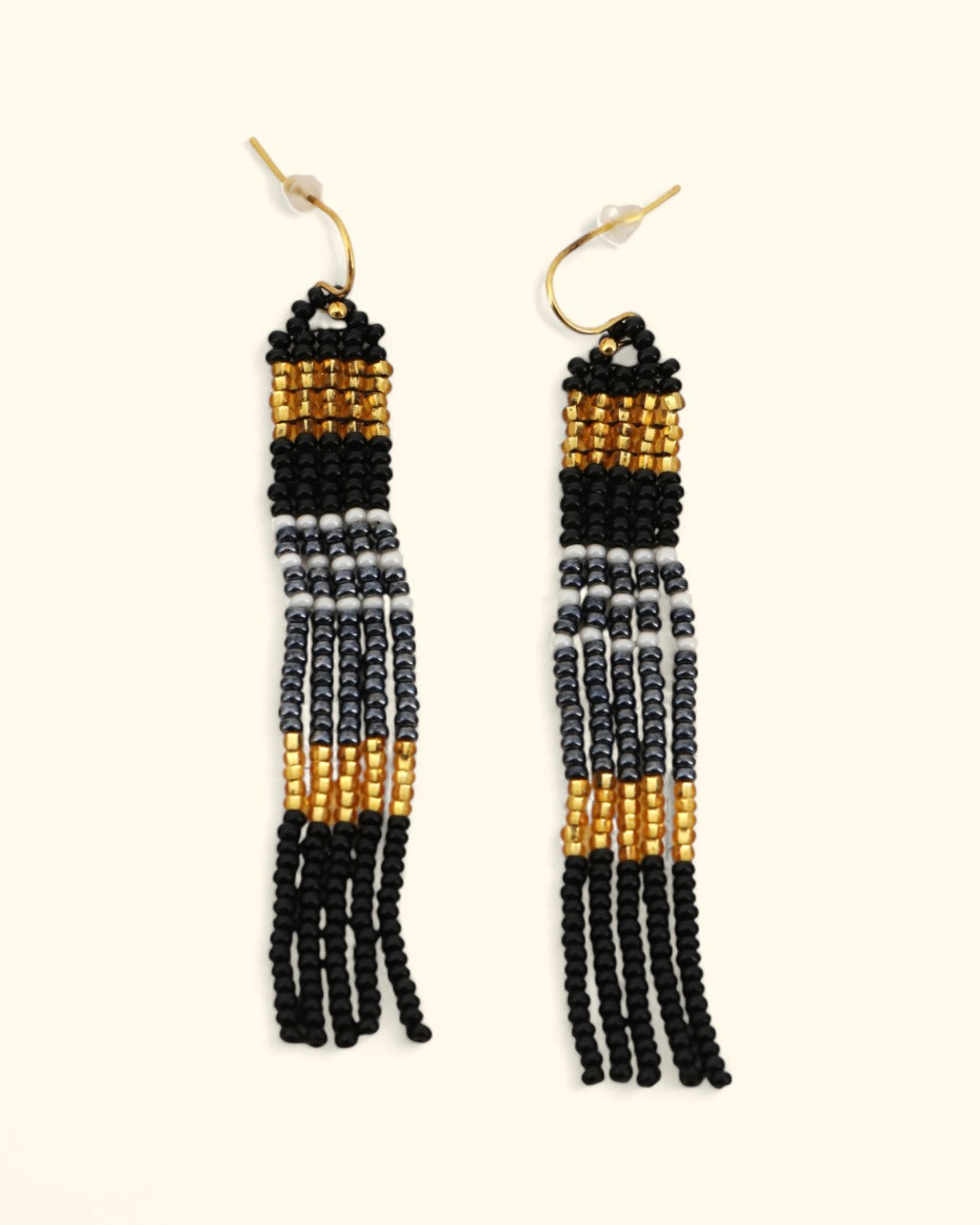 Black, white, and gold beaded column earrings