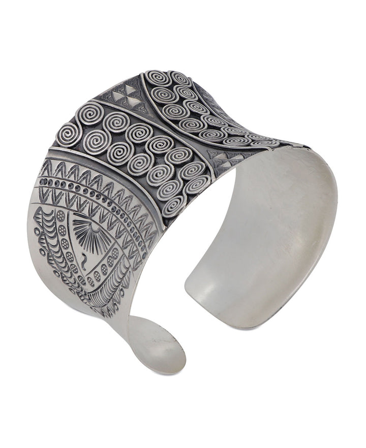 Hilltribe silver wide cuff featuring a mesmerizing tribal swirl design