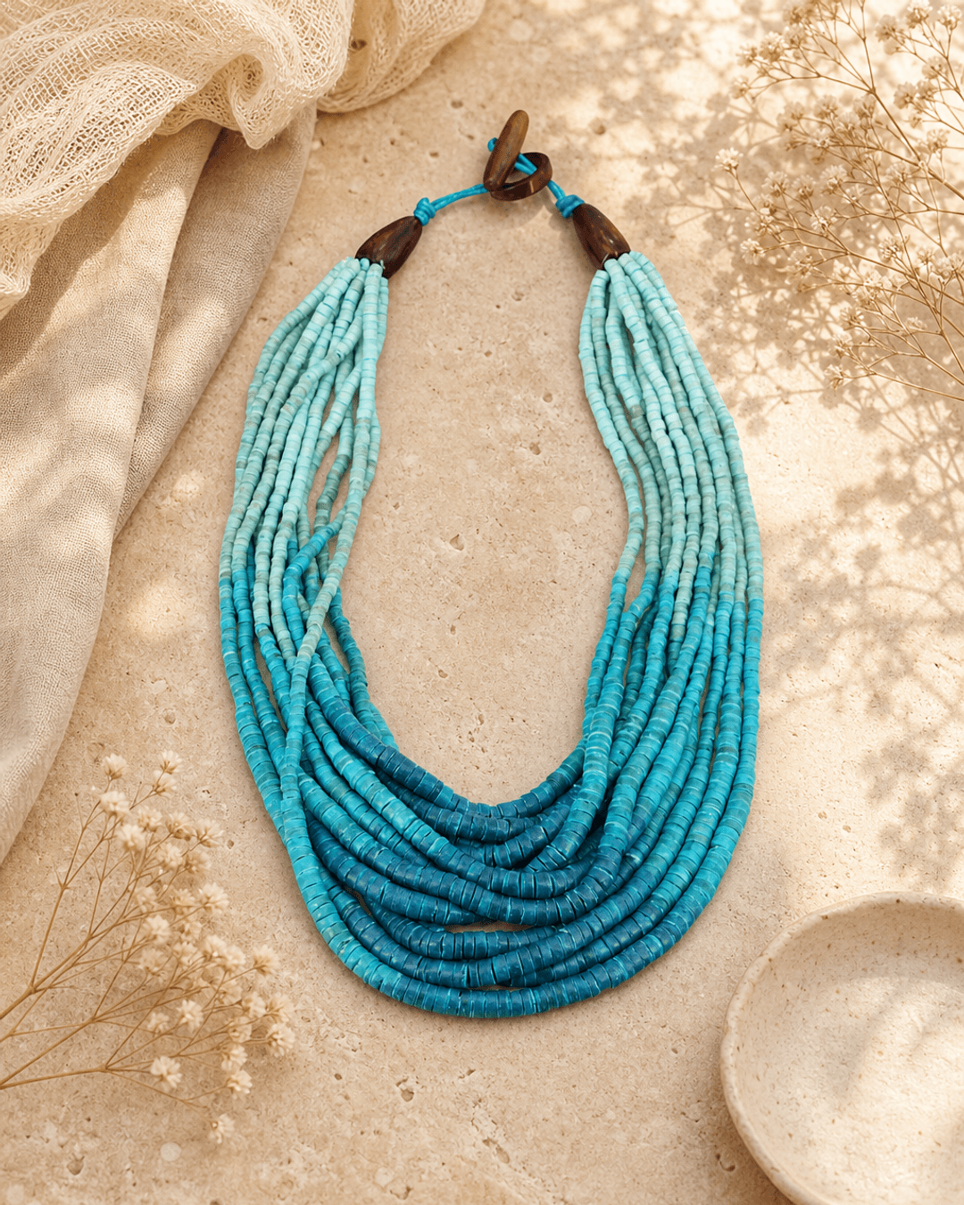 Aqua Ombre Coconut Bead Necklace — necklaces, editorial travertine lifestyle photo