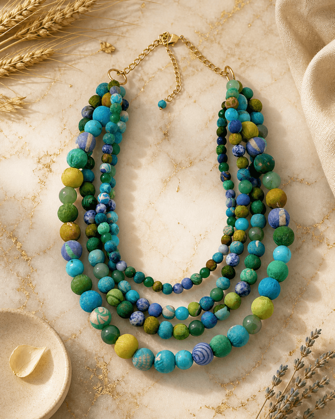 Blue-Green Kantha Bead Statement Necklace — necklaces, editorial marble warm lifestyle photo
