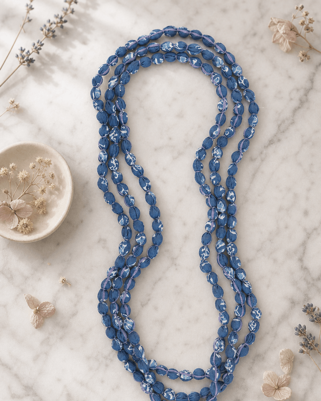Blue Tones Endless Fabric-Wrapped Beaded Necklace — necklaces, editorial marble lifestyle photo