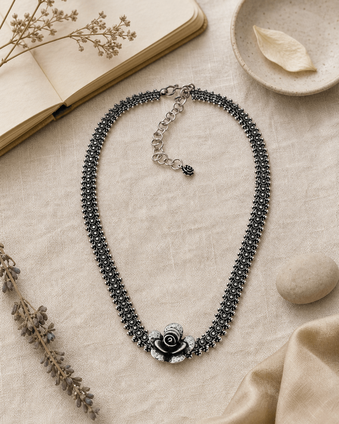 Exquisite Hill-Tribe Silver Collar Necklace with Rose Flower Centerpiece — necklaces, flatlay linen lifestyle photo