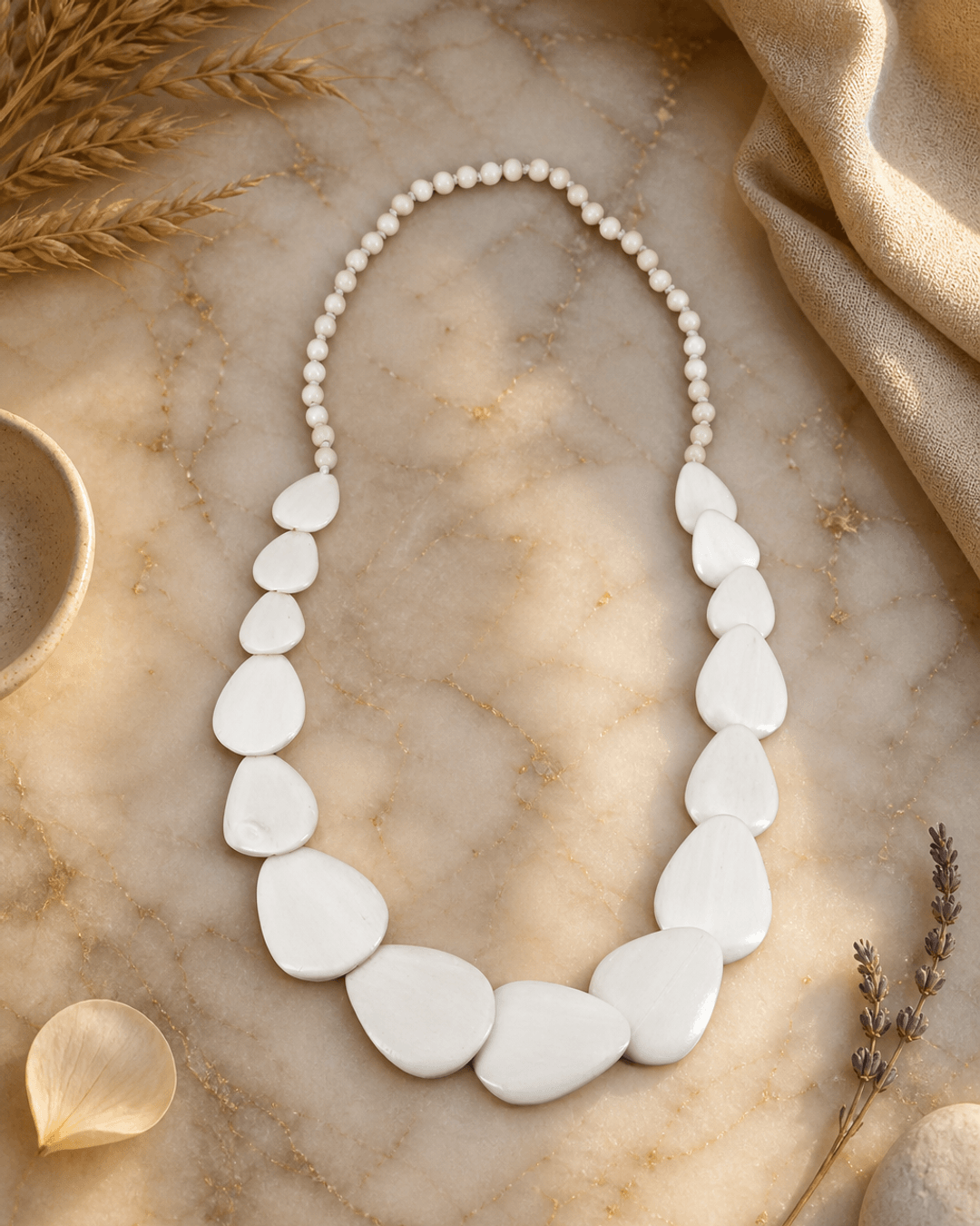 Guitar Pic Inspired Wood Necklace — necklaces, editorial marble warm lifestyle photo