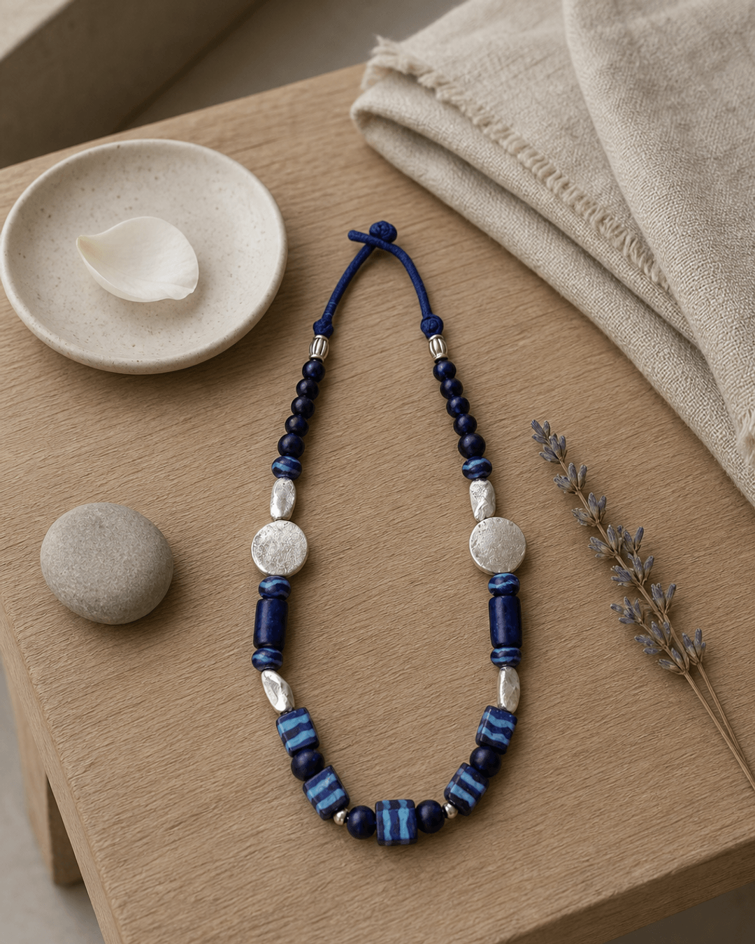 Hand-Painted Ceramic Bead Necklace with Metal Accents — necklaces, meditation corner lifestyle photo
