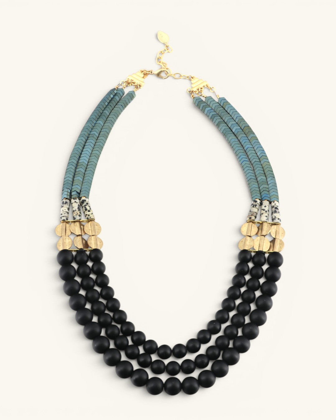 Jet glass and hematite triple strand necklace full front view on white, gold lobster clasp at top with all three bead strands shown