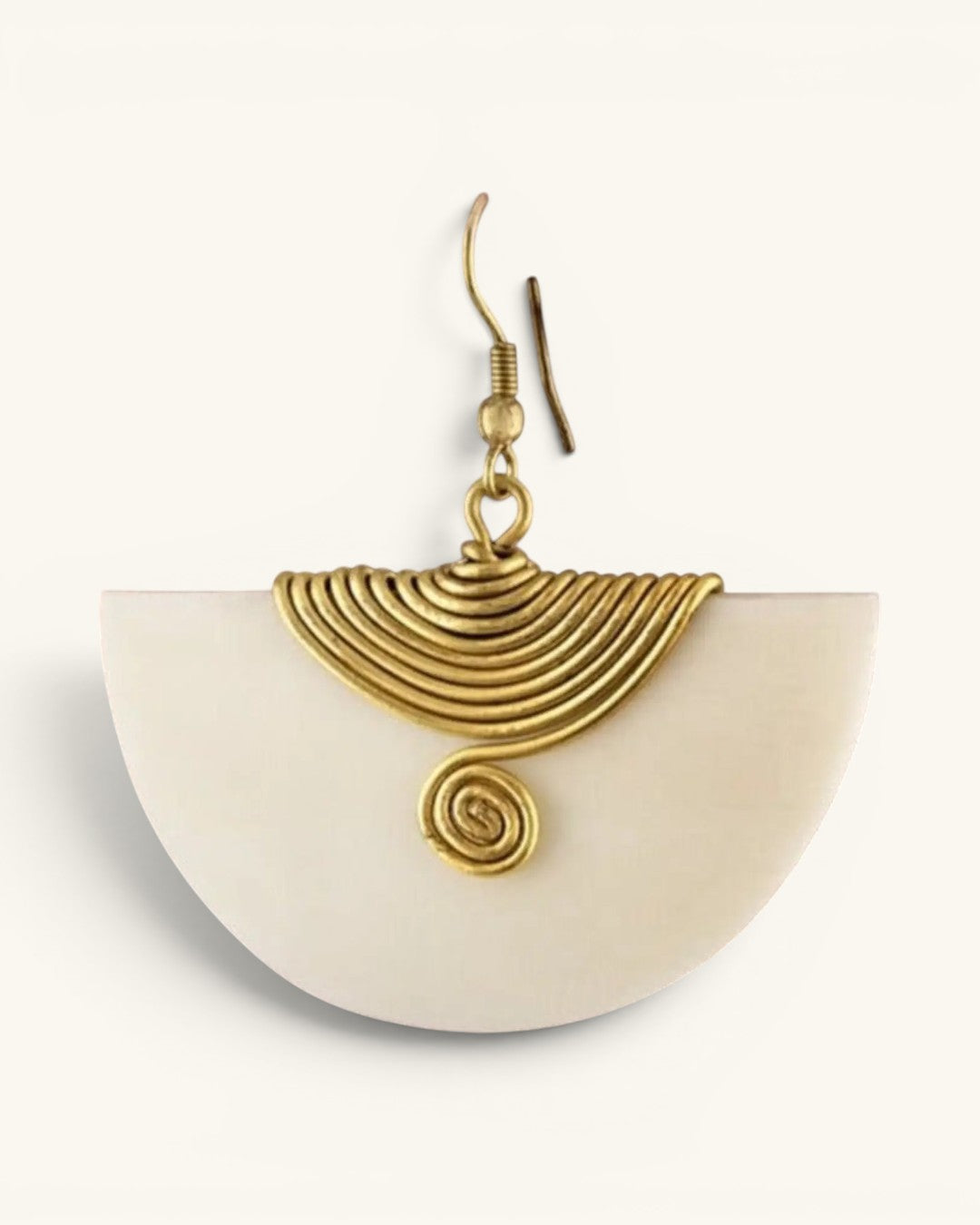Single Kenyan hand-carved bone and brass fan earring, close-up detail view of ridged brass wire fan and spiral center element