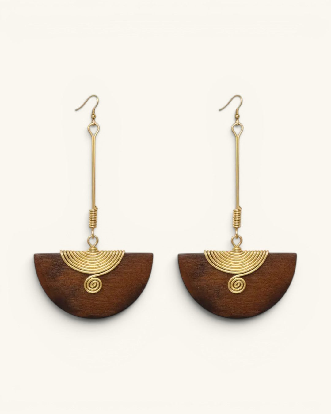 Kenyan handmade brass and wood half-moon drop earrings pair, front view on white background showing brass spiral wire detail