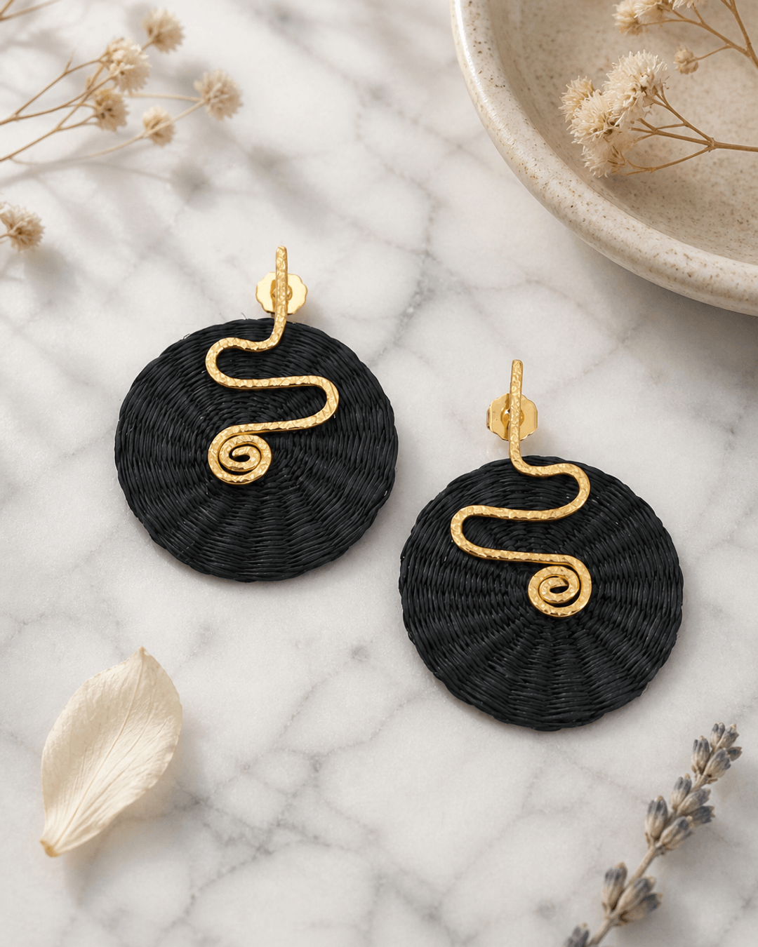 Spiral Colombian Artisanal Iraca Palm Earrings — earrings, editorial marble lifestyle photo