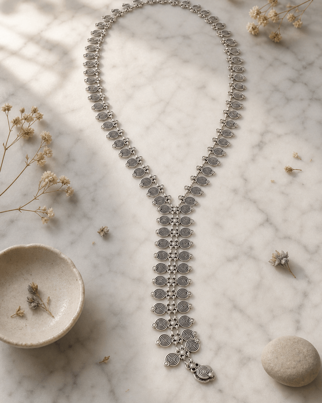 Spiral Elegance Y-Shaped Necklace — necklaces, editorial marble lifestyle photo