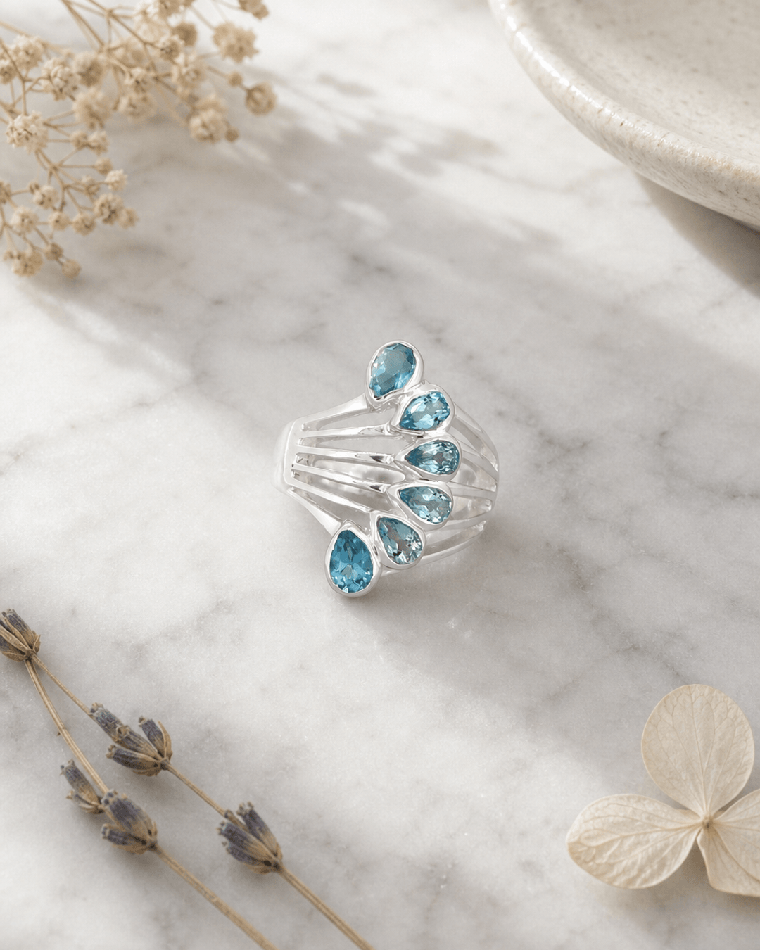 Sterling Silver Teardrop Gemstones Blue Topaz Ring — rings, editorial marble lifestyle photo