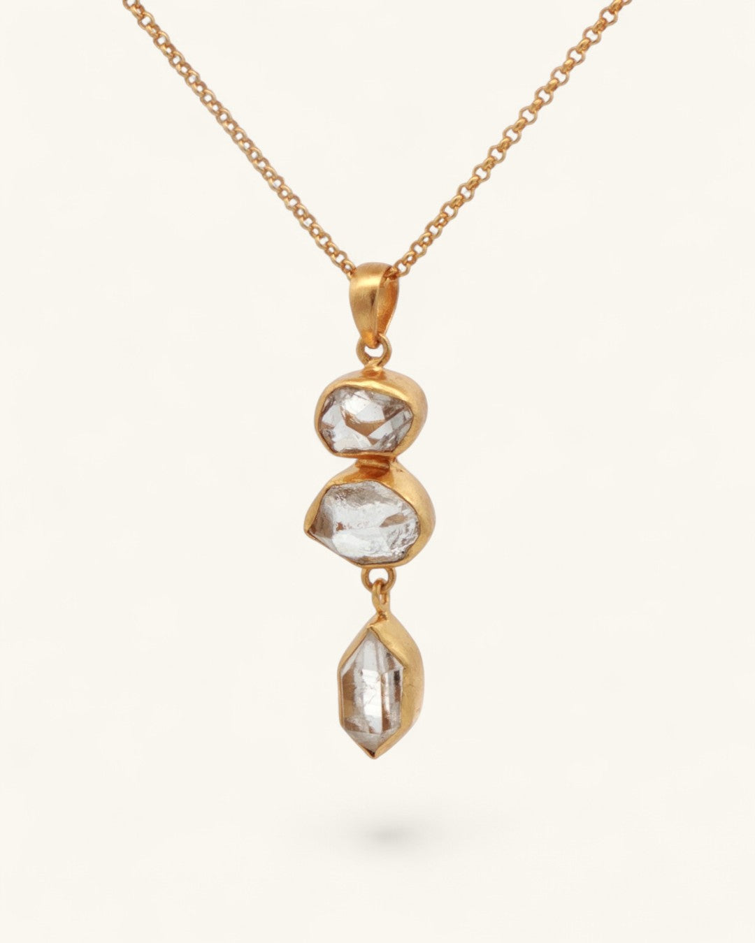 Triple Herkimer Quartz gold-plated pendant with gold cable chain, angled front view showing three stacked Herkimer stones