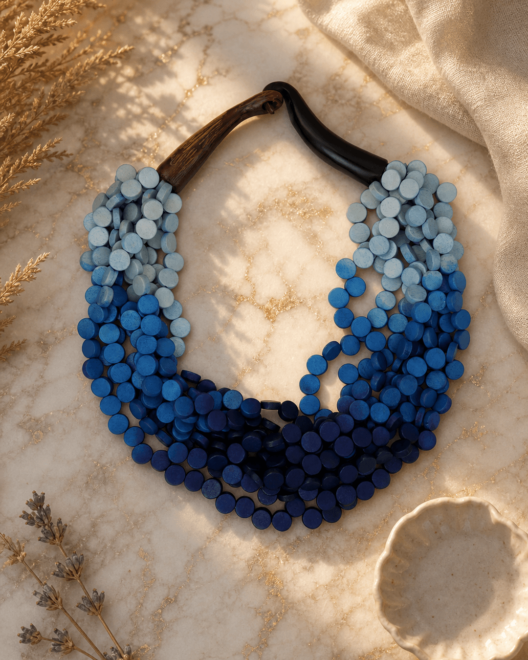 Twisted Multi-Strand Blue Necklace — necklaces, editorial marble warm lifestyle photo