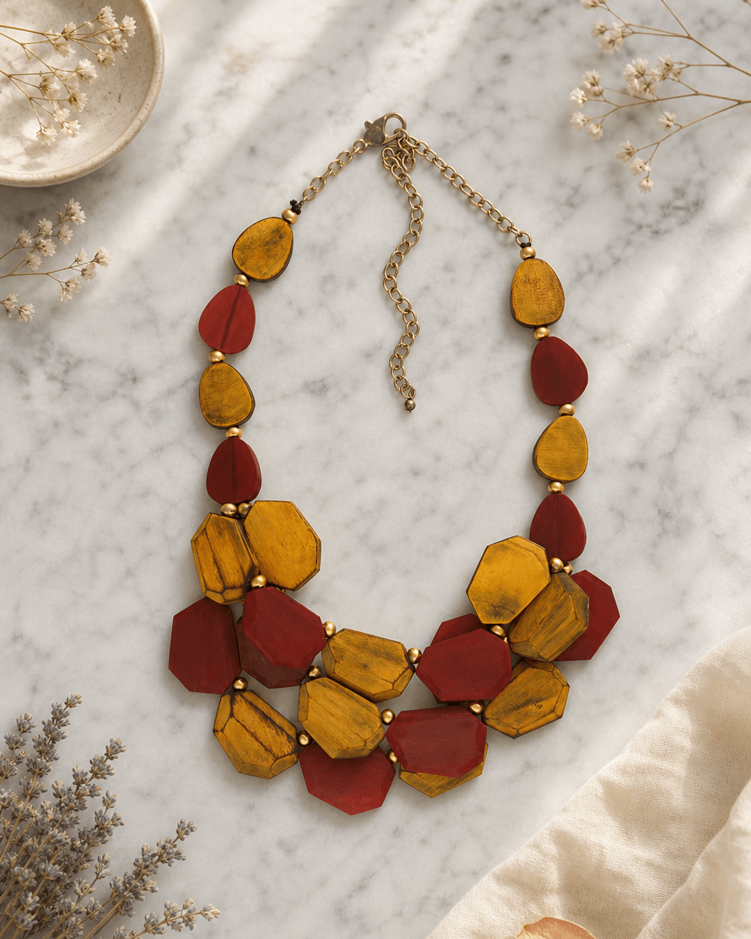 Yellow and Red Dyed Horn Necklace — necklaces, editorial marble lifestyle photo