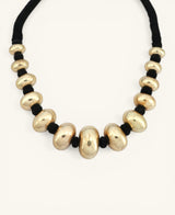 hampagne gold chunky bead choker necklace on black cord